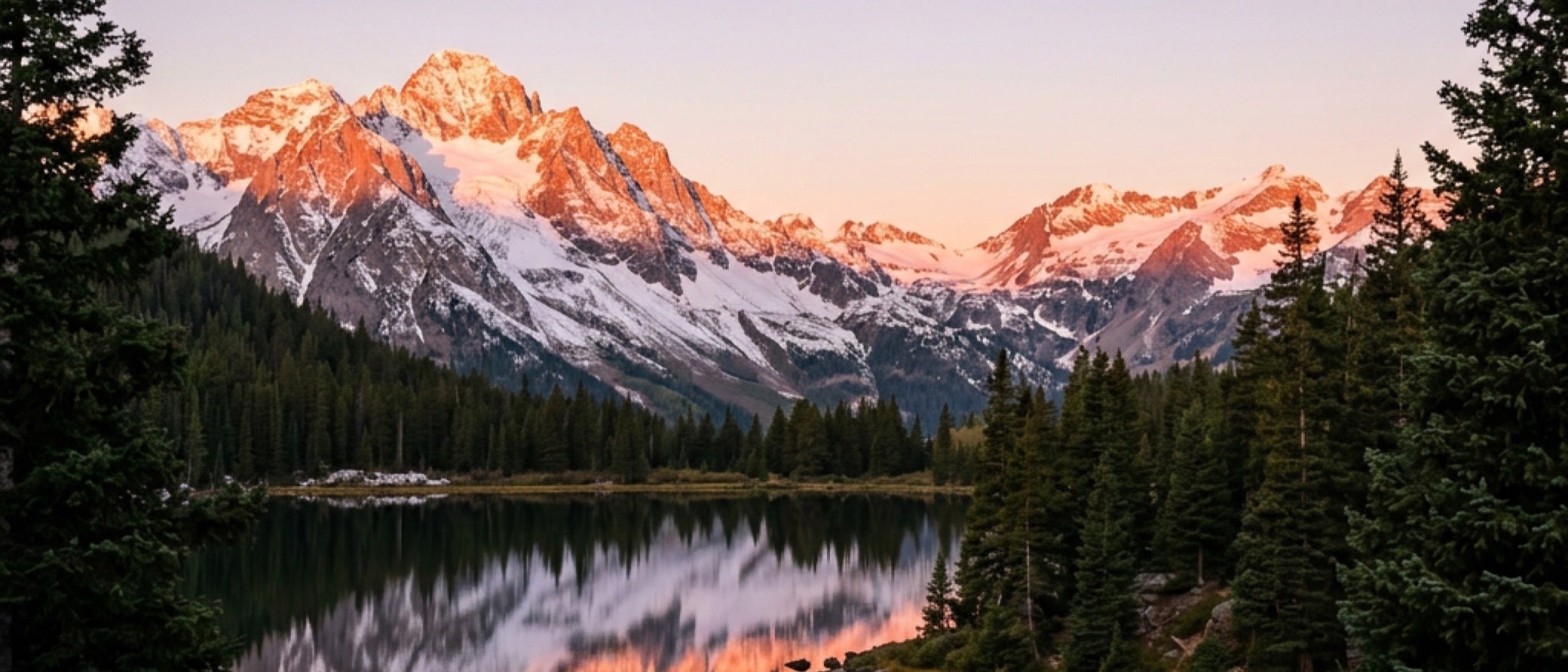 Colorado alpenglow mountain and lake landscape