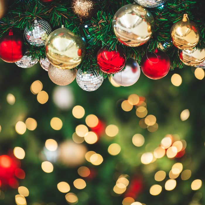 Custom metal photo ornaments hanging on tree